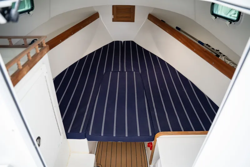 Slide: The Image of Interior of Eastern 248 Explorer boat, 2022 model, with striped upholstery. - 11