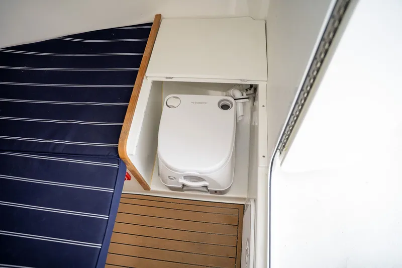Slide: The Image of Interior of 2022 Eastern 248 Explorer with toilet and seating area. - 12