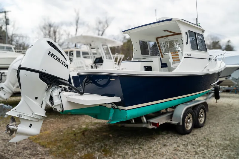 Slide: The Image of 2022 Eastern 248 Explorer boat with Honda outboard motor. - 4