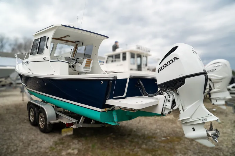 Slide: The Image of 2022 Eastern 248 Explorer boat with Honda outboard motor. - 5