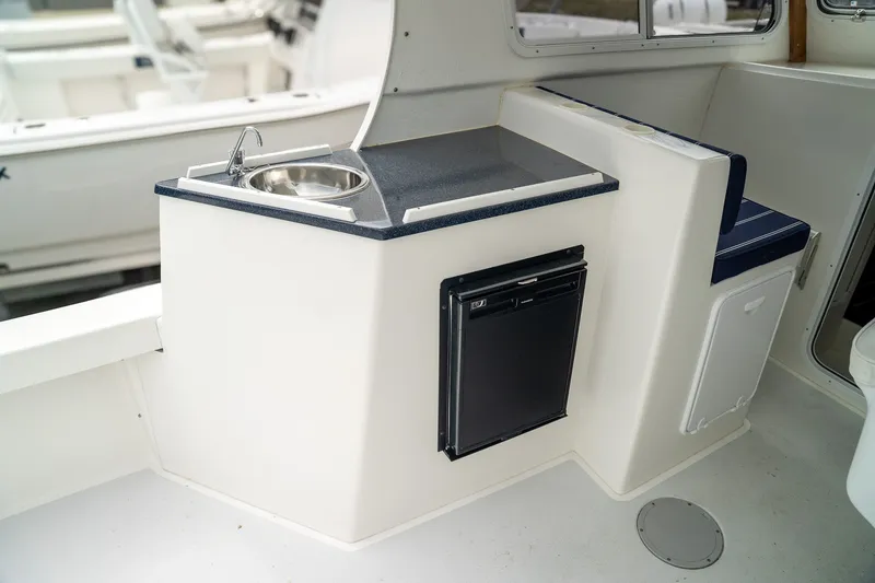 Slide: The Image of Interior of 2022 Eastern 248 Explorer with sink and refrigerator. - 7