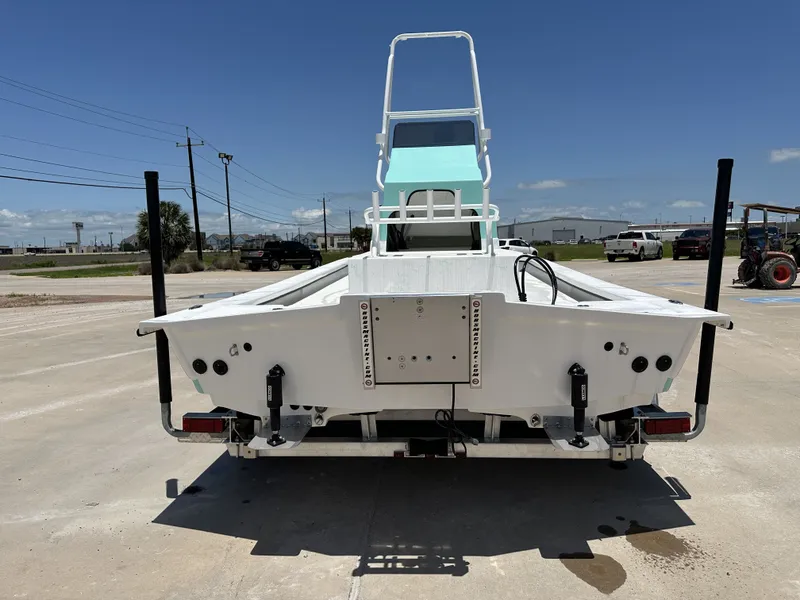 Slide: The Image of Rear view of a 2026 Shoalwater 23' Catamaran on a parking lot. - 11