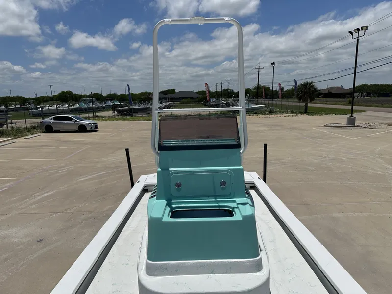 Slide: The Image of 2026 Shoalwater 23' Catamaran on a parking lot under sunny skies. - 15