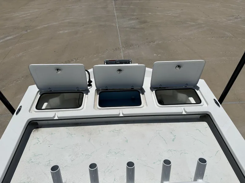 Slide: The Image of 2026 Shoalwater 23' Catamaran with open storage compartments. - 20