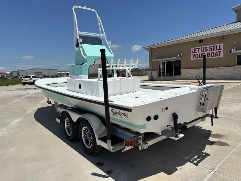 Slide: The Image of 2026 Shoalwater 23' Catamaran on trailer outside sales building. - 8