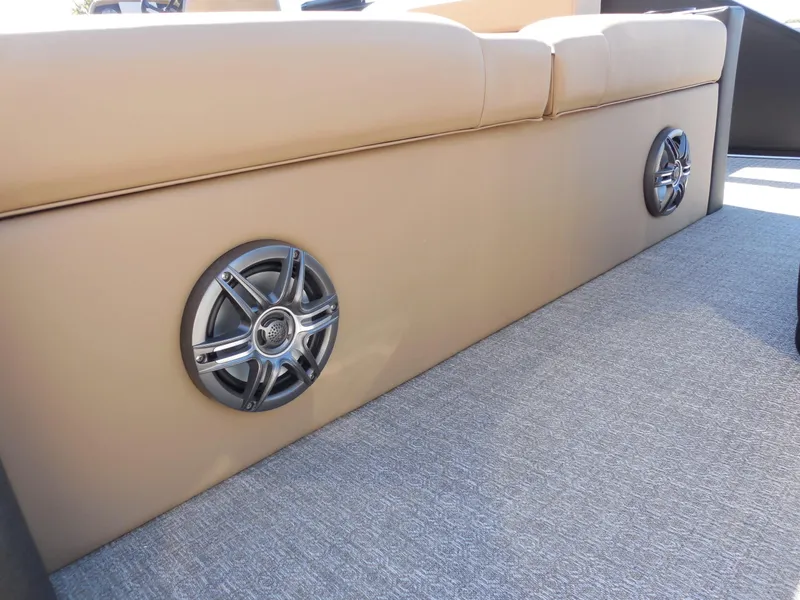 Slide: The Image of The 2027 Evotti 525CS features beige upholstery with built-in speakers on a textured carpeted floor. - 24