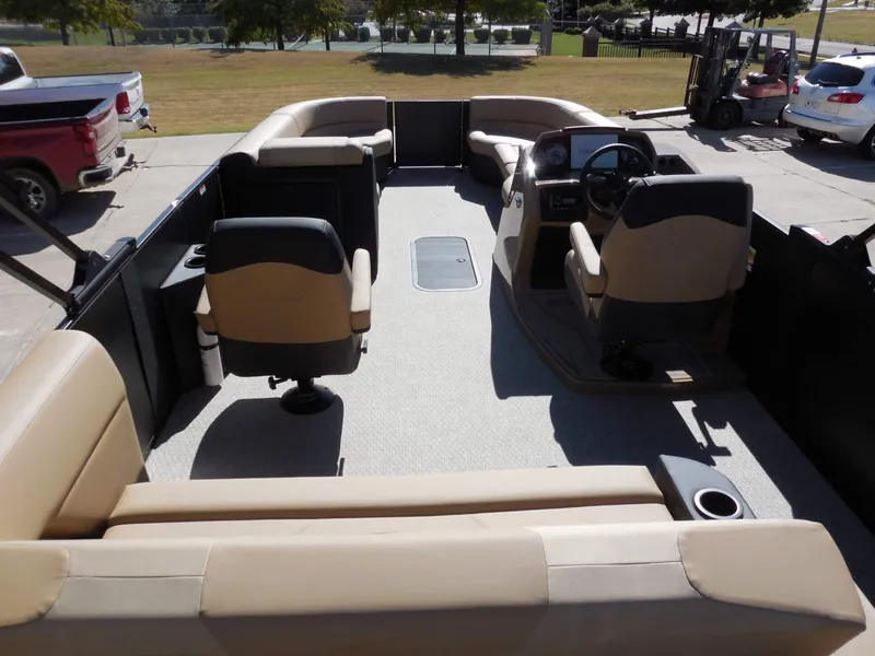 Slide: The Image of The image shows the interior of a 2027 Evotti 525CS with beige seating and a helm station. - 25