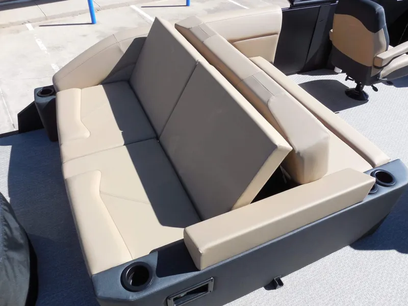 Slide: The Image of The 2027 Evotti 525CS features a beige, cushioned bench seat with cup holders. - 21