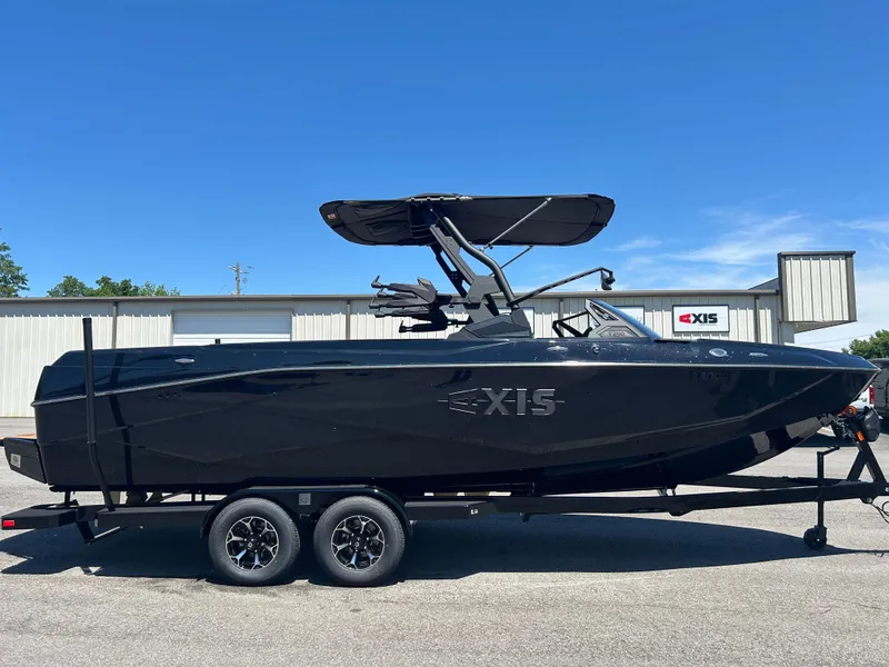 The Image of Black Axis T250 boat, 2026 model, on trailer in front of building. - 1
