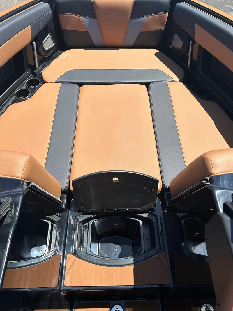 Slide: The Image of Interior of Axis T250 boat, 2026 model, featuring brown and black seating. - 14
