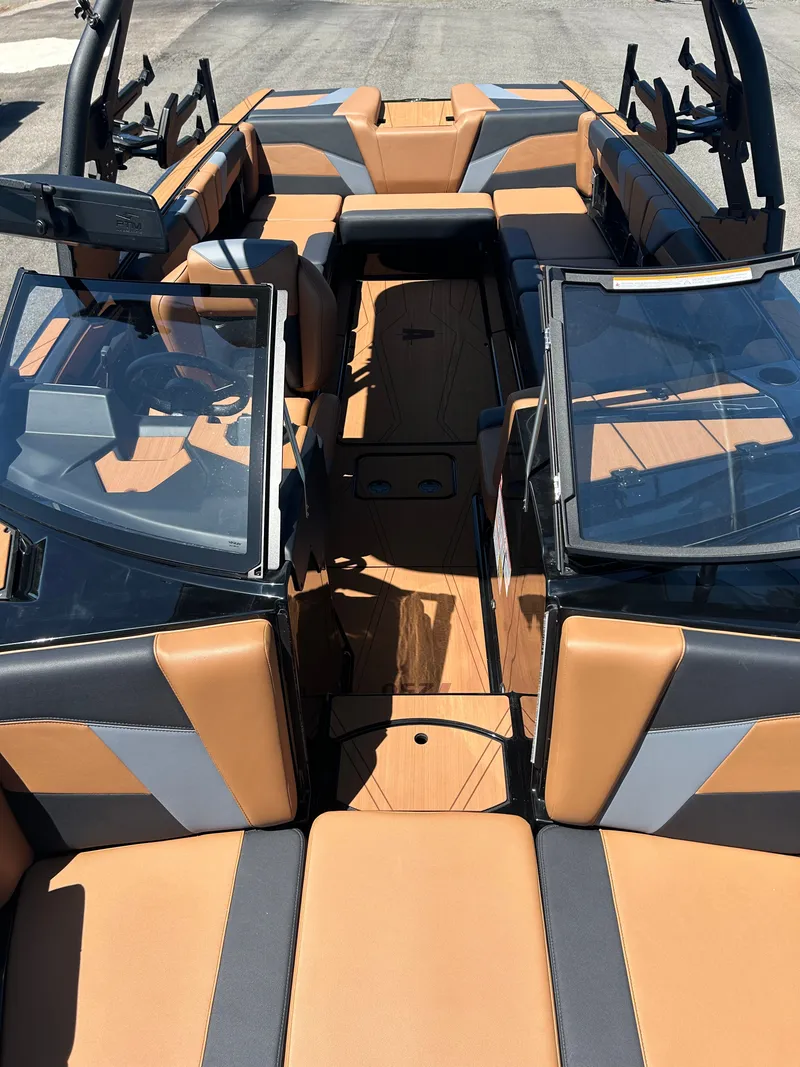 Slide: The Image of Interior of Axis T250 boat, 2026 model, featuring brown and gray seating. - 15