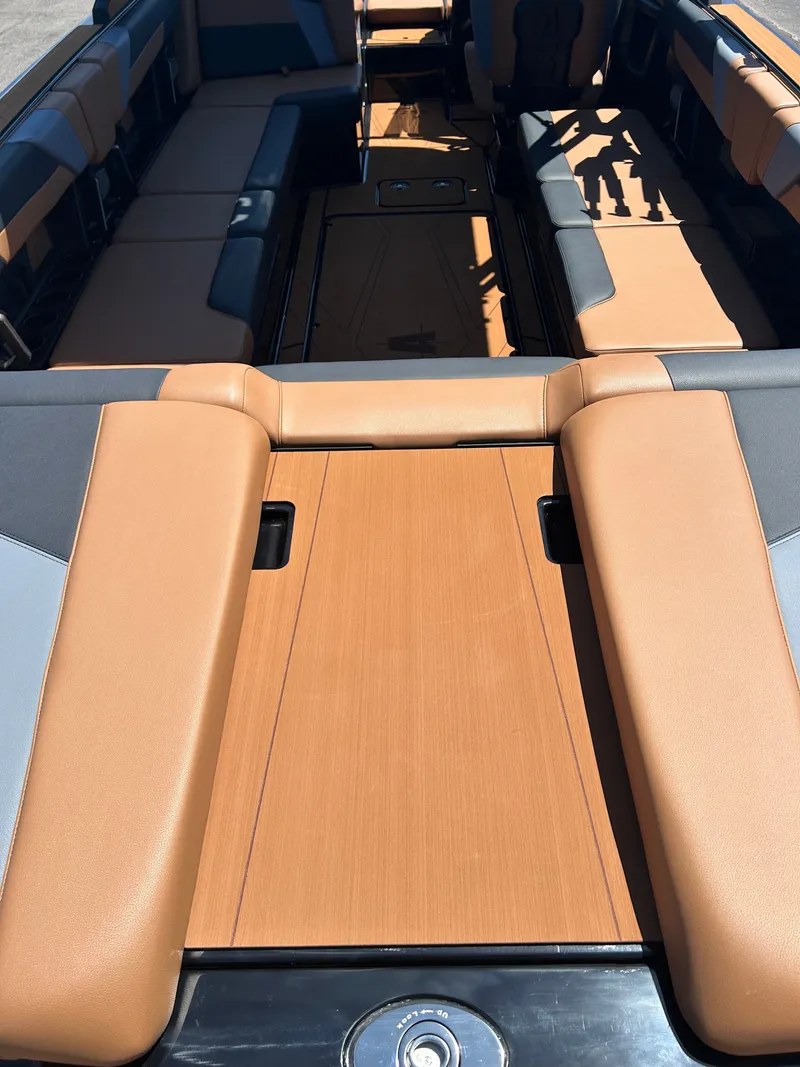 Slide: The Image of Interior of Axis T250 boat, 2026 model, featuring brown upholstery. - 4