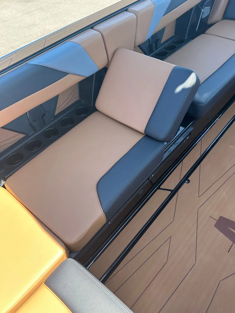 Slide: The Image of Axis T250 2026 boat seat with brown and black upholstery design. - 6
