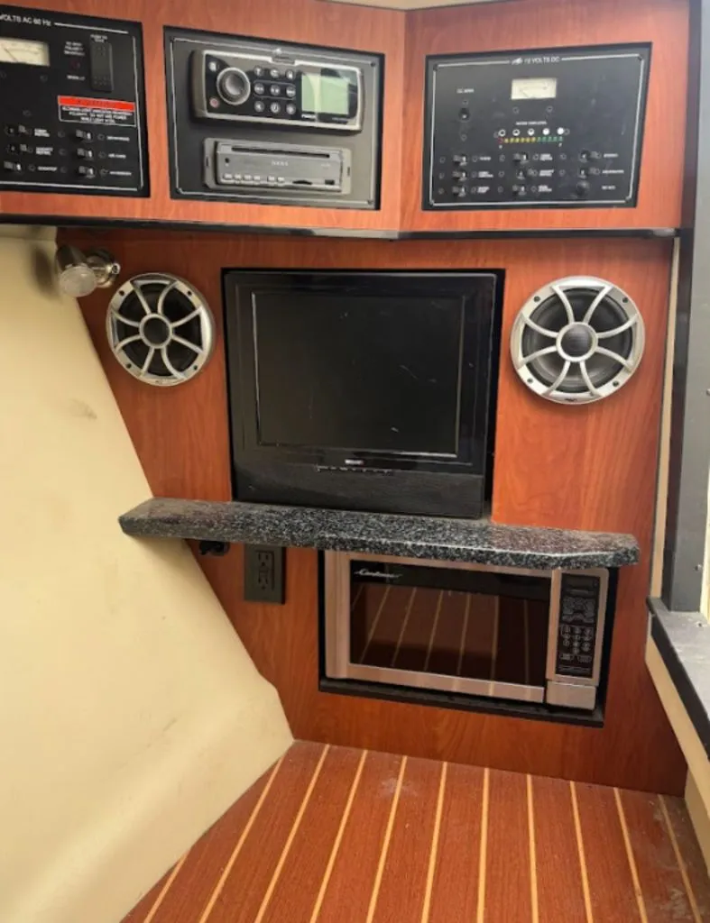 Slide: The Image of Interior of a 2011 Monterey 328SS with entertainment system. - 11