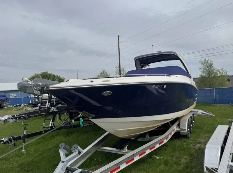 Slide: The Image of 2011 Monterey 328SS Super Sport boat on trailer outdoors. - 2