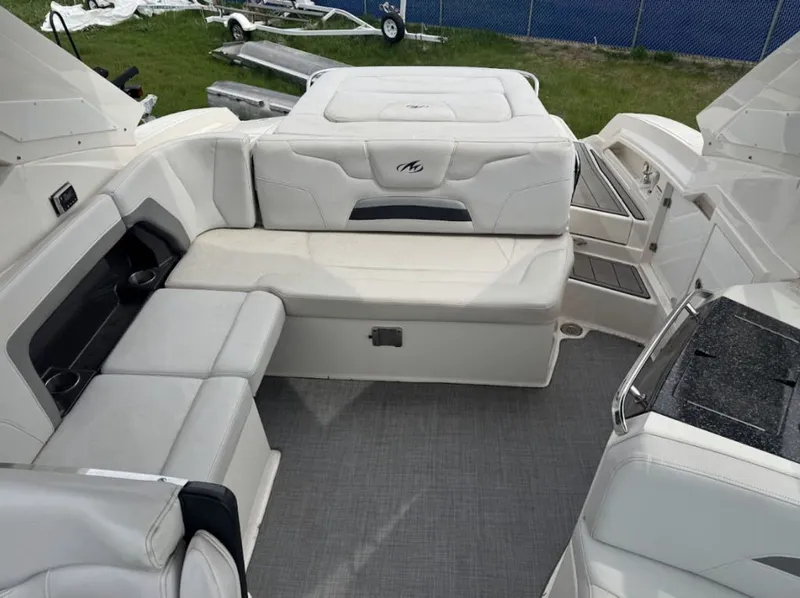 Slide: The Image of Interior of a 2011 Monterey 328SS Super Sport boat with white seating. - 7