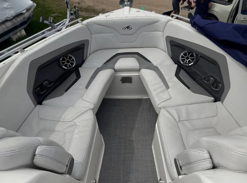 Slide: The Image of Interior of a 2011 Monterey 328SS Super Sport boat with white seating. - 8