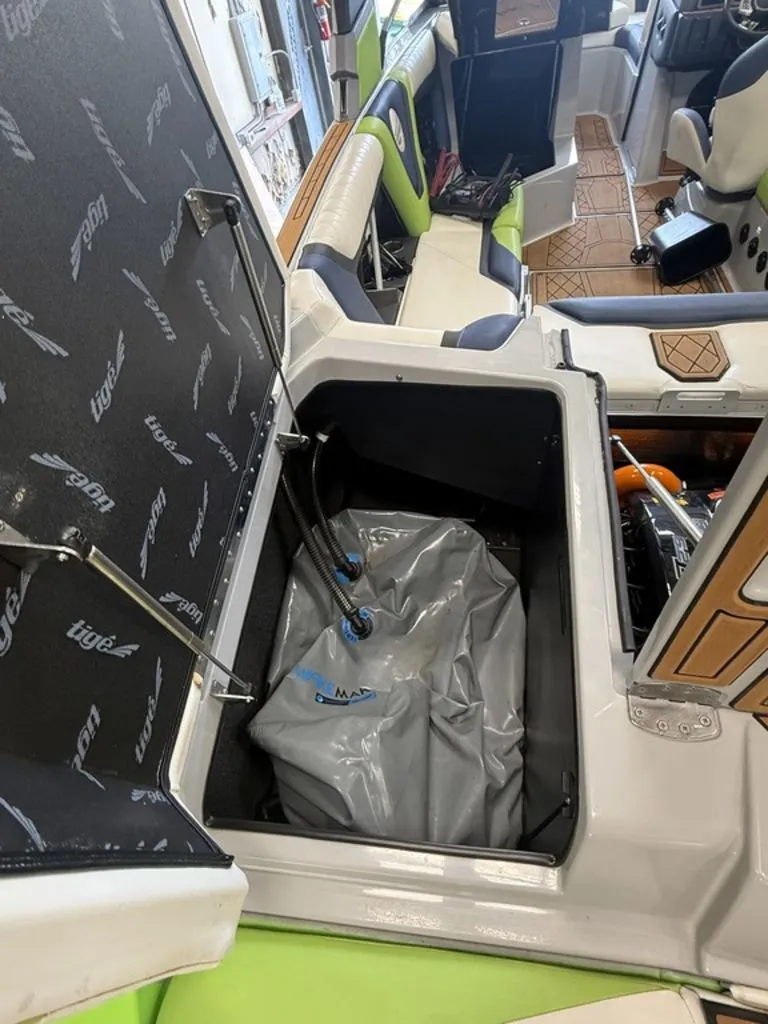 Slide: The Image of Interior of a 2020 Tigé 23ZX boat with storage compartment. - 6
