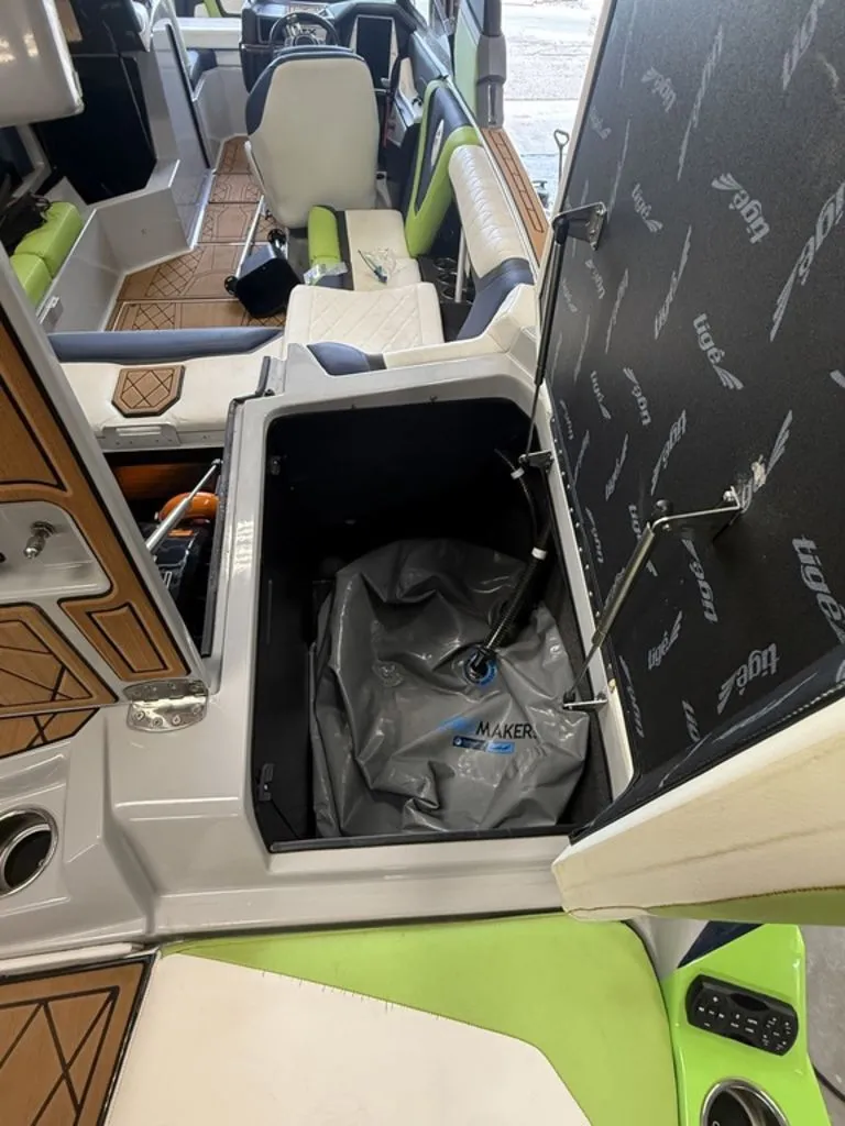 Slide: The Image of Interior of a 2020 Tigé 23ZX boat with open storage compartment. - 7