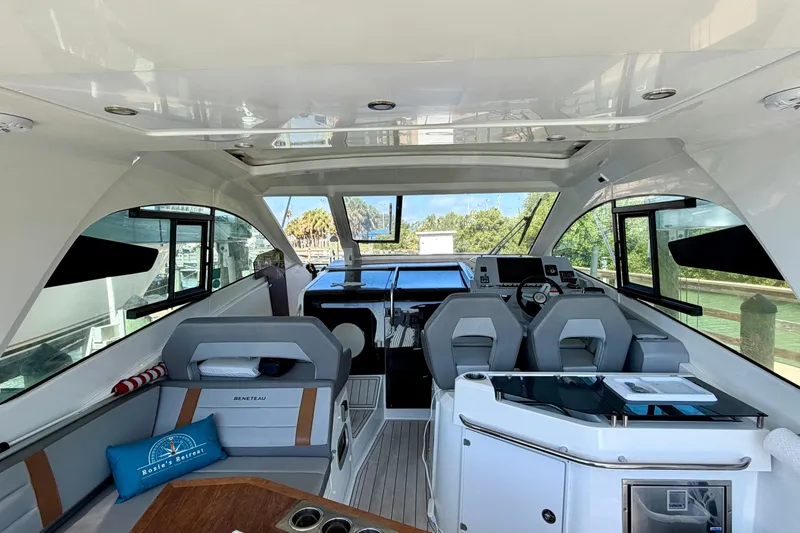 Slide: The Image of 2024 Beneteau Gran Turismo 32 yacht interior with modern helm and seating area. - 10