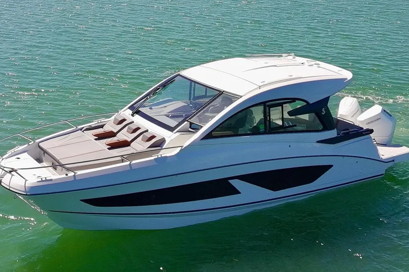 Slide: The Image of 2024 Beneteau Gran Turismo 32 yacht cruising on clear blue water. - 30