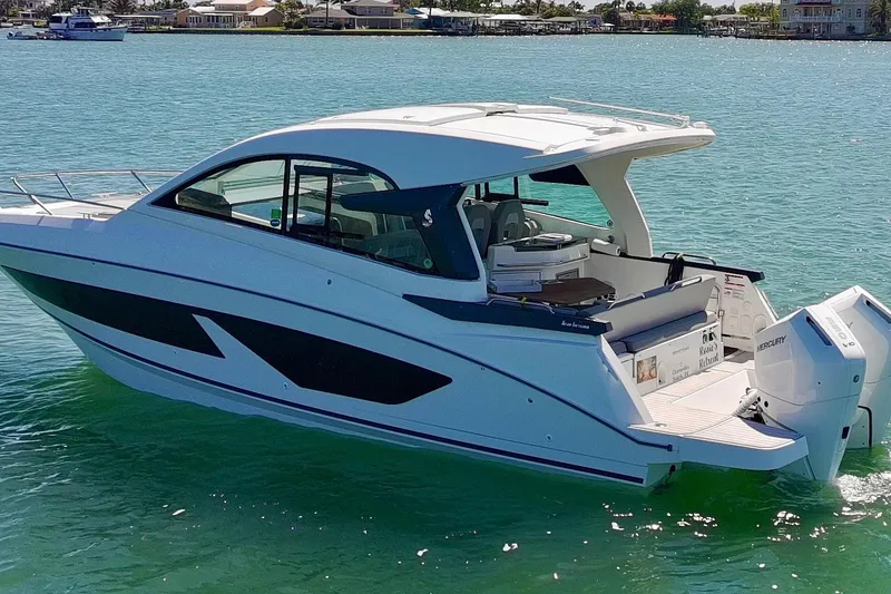 Slide: The Image of 2024 Beneteau Gran Turismo 32 yacht cruising on clear blue water. - 31