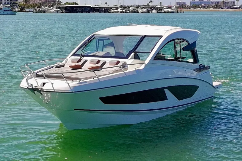 Slide: The Image of 2024 Beneteau Gran Turismo 32 yacht on clear blue water. - 35