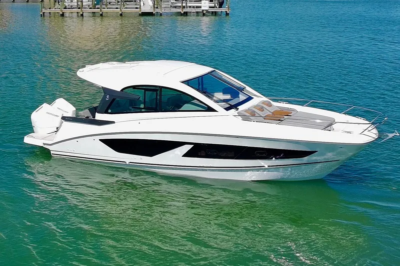 Slide: The Image of 2024 Beneteau Gran Turismo 32 yacht on clear blue water, showcasing sleek design. - 36