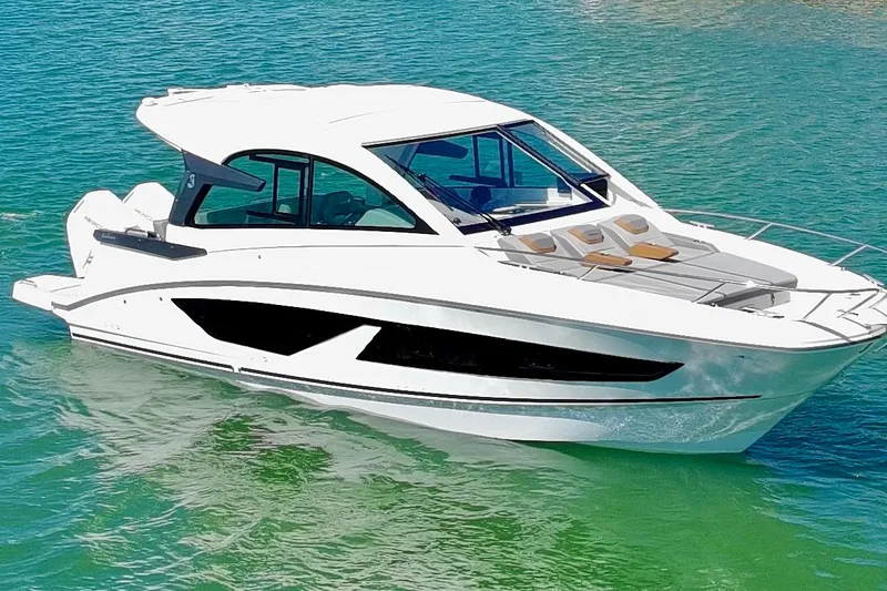 Slide: The Image of 2024 Beneteau Gran Turismo 32 yacht on clear turquoise water. - 37