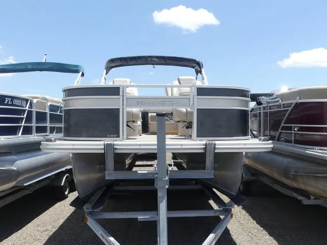 Slide: The Image of 2016 Bennington 21 SFX Premium pontoon boat on trailer. - 2