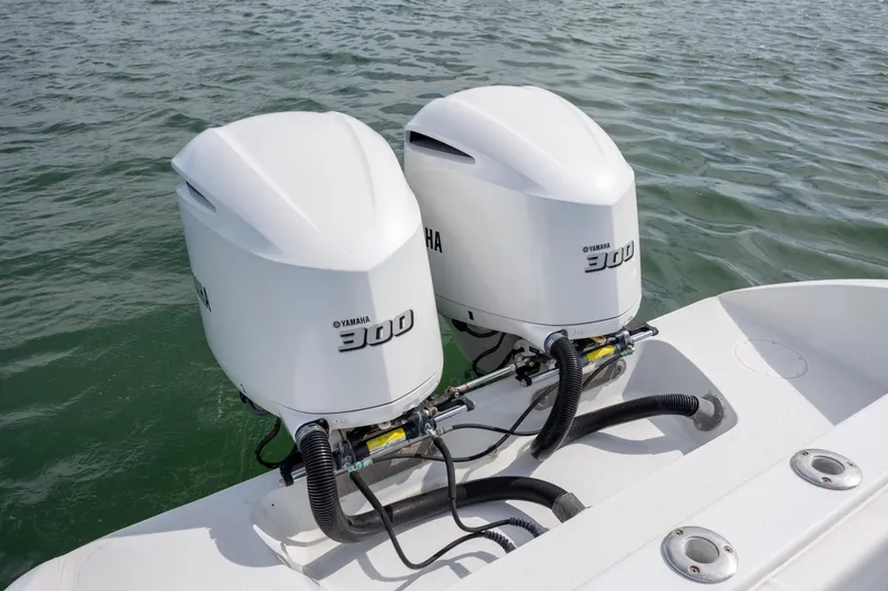 Slide: The Image of Twin Yamaha 300 engines on a 2002 Yellowfin 31 Center Console boat. - 11