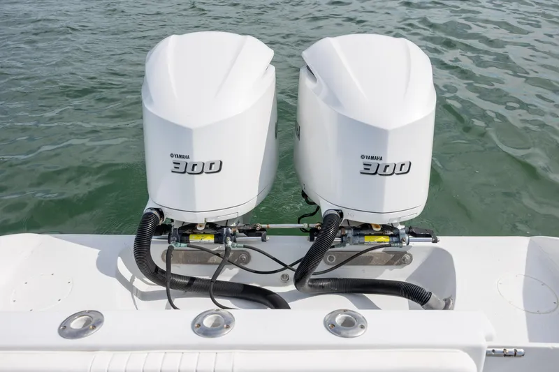 Slide: The Image of Twin Yamaha 300 engines on a 2002 Yellowfin 31 Center Console boat. - 12