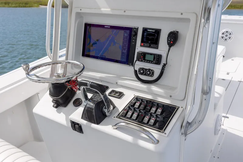 Slide: The Image of Center console of 2002 Yellowfin 31 boat with navigation and control systems. - 17