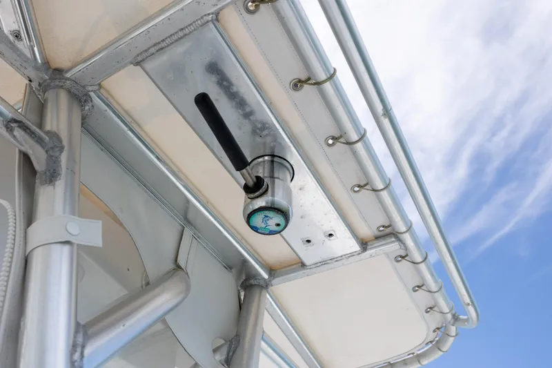 Slide: The Image of Close-up of a 2002 Yellowfin 31 Center Console boat's T-top structure against a blue sky. - 18