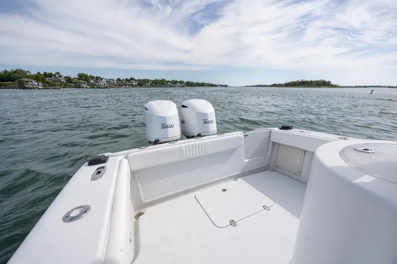 Slide: The Image of 2002 Yellowfin 31 Center Console boat with twin engines on open water. - 9