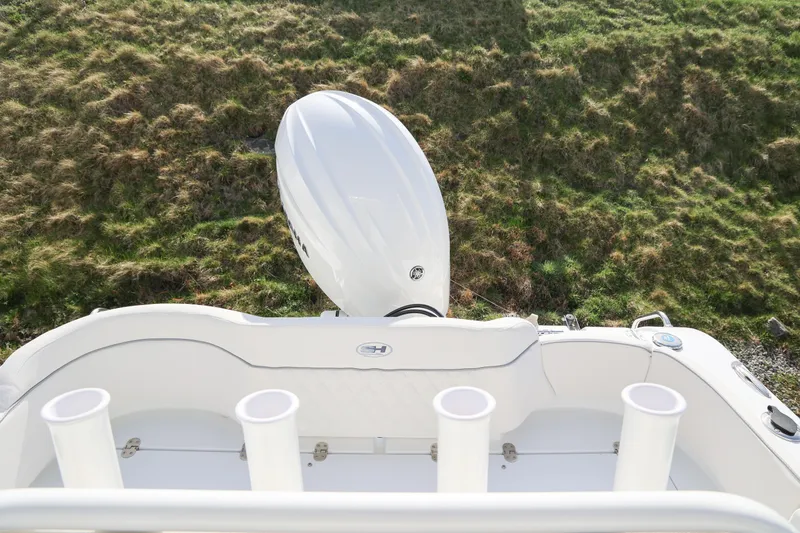 Slide: The Image of 2026 Sea Hunt Ultra 219 boat with outboard motor, viewed from above. - 13