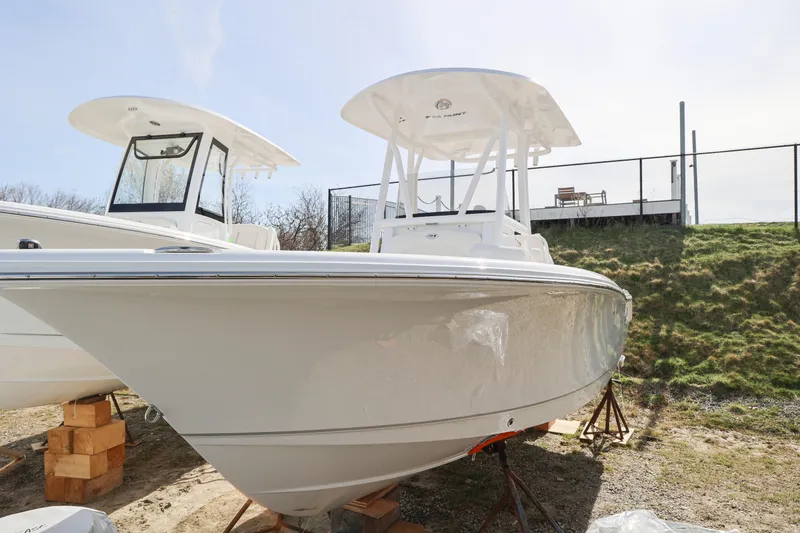Slide: The Image of 2026 Sea Hunt Ultra 219 boat displayed outdoors on a sunny day. - 3
