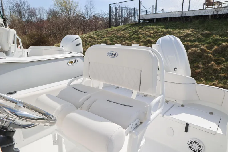 Slide: The Image of 2026 Sea Hunt Ultra 219 boat interior with white seating and Yamaha engine. - 7