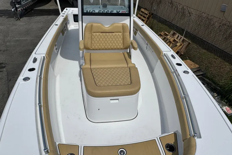 Slide: The Image of 2024 Sportsman Masters 267 Bay Boat with tan seating and spacious deck. - 19
