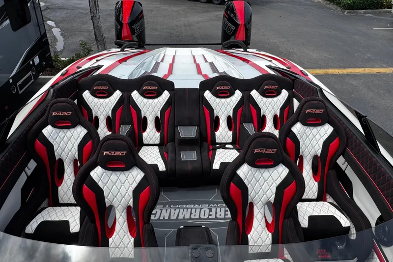 Slide: The Image of 2025 Performance Powerboats P420 interior with red and white racing seats. - 10