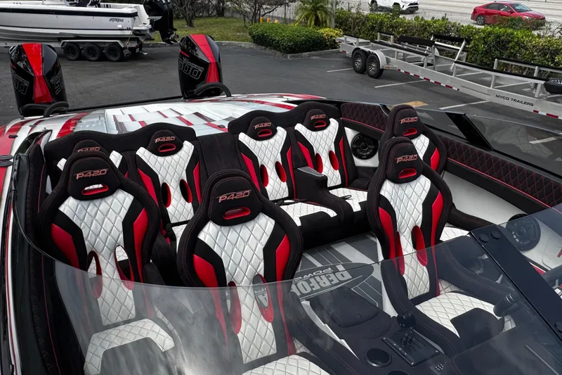 Slide: The Image of 2025 Performance Powerboats P420 interior with red and white racing seats, showcasing luxury design. - 11