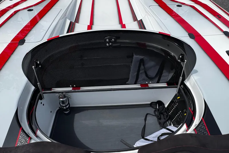 Slide: The Image of Open storage compartment of 2025 Performance Powerboats P420 with sleek design and red accents. - 15