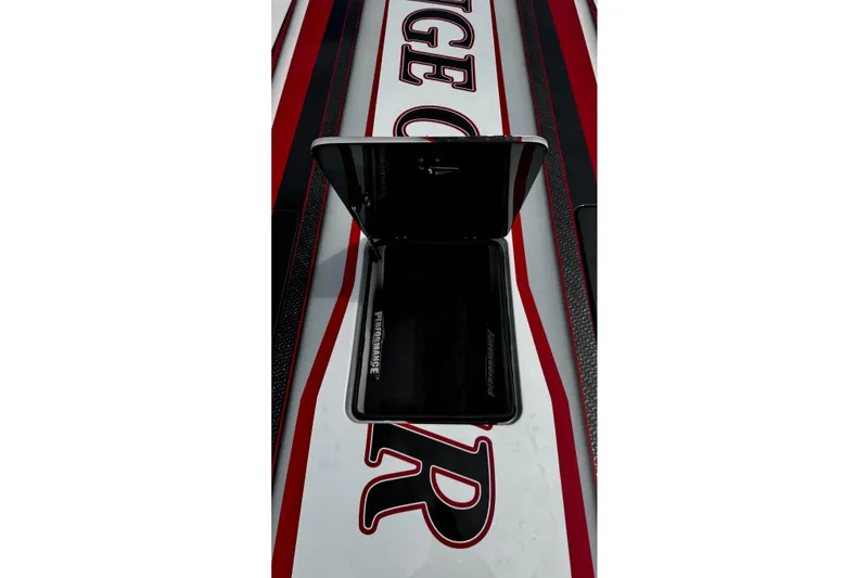 Slide: The Image of 2025 Performance Powerboats P420 with open storage compartment, red and black detailing. - 19