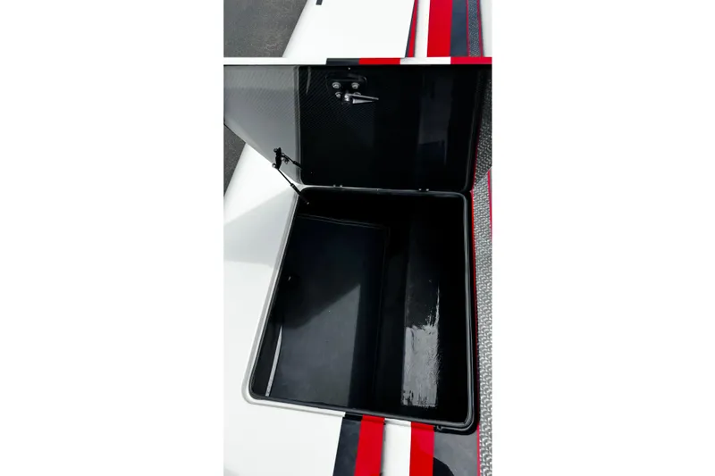 Slide: The Image of Open storage compartment of 2025 Performance Powerboats P420, featuring sleek design and red accents. - 20