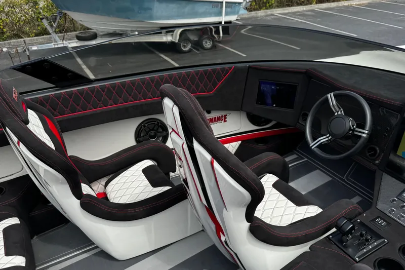 Slide: The Image of Interior of 2025 Performance Powerboats P420, featuring sleek seats and modern dashboard design. - 21