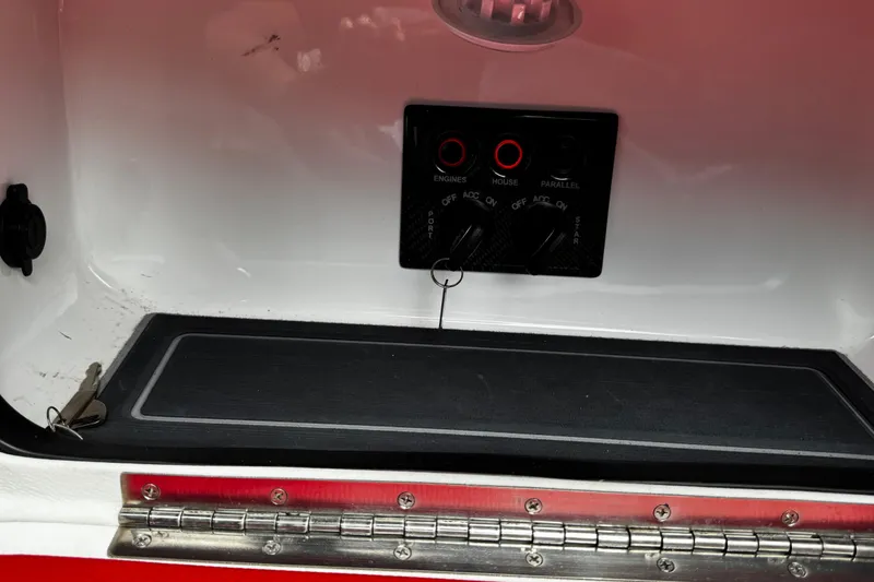Slide: The Image of Control panel of 2025 Performance Powerboats P420, featuring engine and house switches. - 24