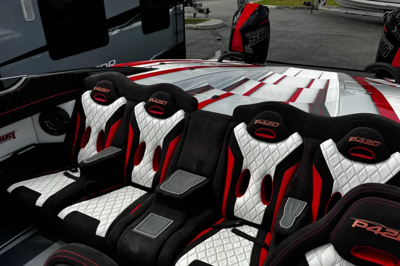Slide: The Image of Luxurious interior of 2025 Performance Powerboats P420 with stylish red and white seating. - 26