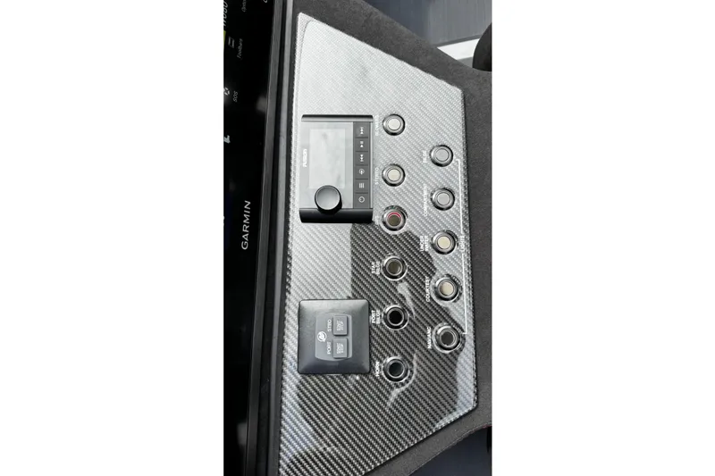 Slide: The Image of Control panel of 2025 Performance Powerboats P420 with carbon fiber finish and Garmin display. - 27