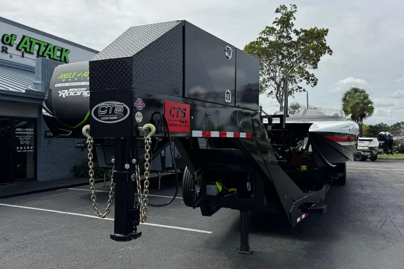 Slide: The Image of 2025 Performance Powerboats P420 on custom trailer outside dealership. - 30