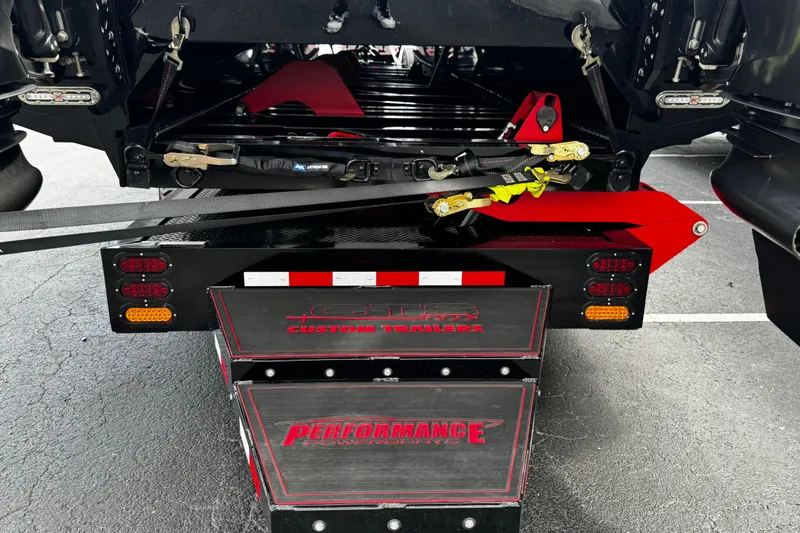 Slide: The Image of Rear view of a 2025 Performance Powerboats P420 trailer with custom features and secure straps. - 33